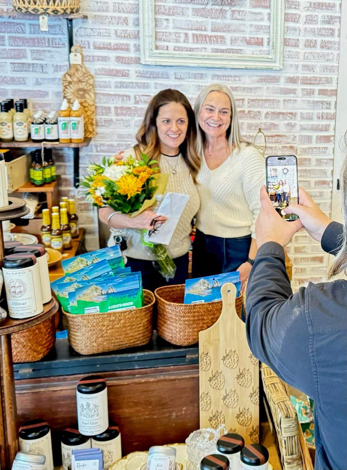 Starr Hall handed over the keys to her store, Arch & Starr, in downtown Gig Harbor to Tiffany Brooks on Sept. 20, 2024. Under Brooks, the store will become CURATED-Gig Harbor, a gifting boutique.