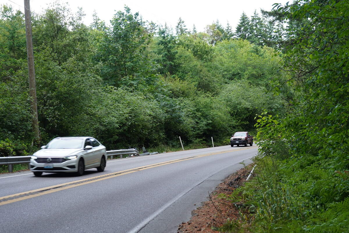 Cars pass the guardrail along state Route 302 between mileposts 13.9 and 14 in the Wauna area of the Key Peninsula, Tuesday, June 9, 2026.