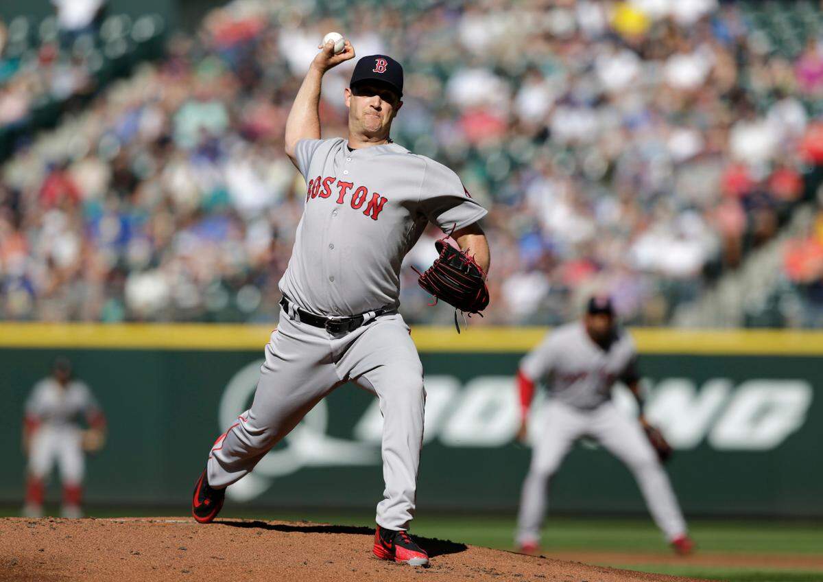 Boston Red Sox starting pitcher Steven Wright works against the Seattle Mariners during the first inning of a baseball game Saturday, June 16, 2018, in Seattle. (AP Photo/John Froschauer)