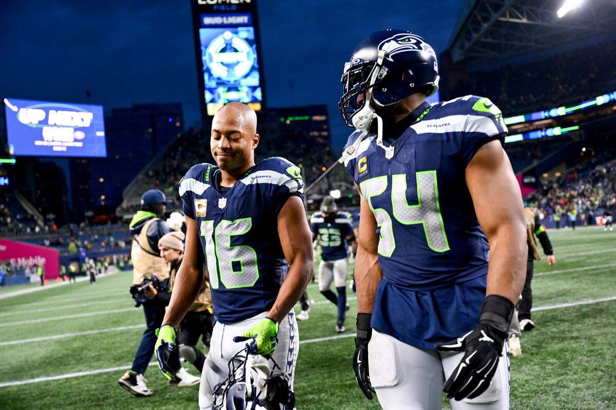 Seattle Seahawks wide receiver Tyler Lockett (16) and linebacker Bobby Wagner (54) walk off the field after the Seahawks 29-26 victory against the Washington Commanders at Lumen Field, on Sunday, Nov. 12, 2023, in Seattle, Wash.
