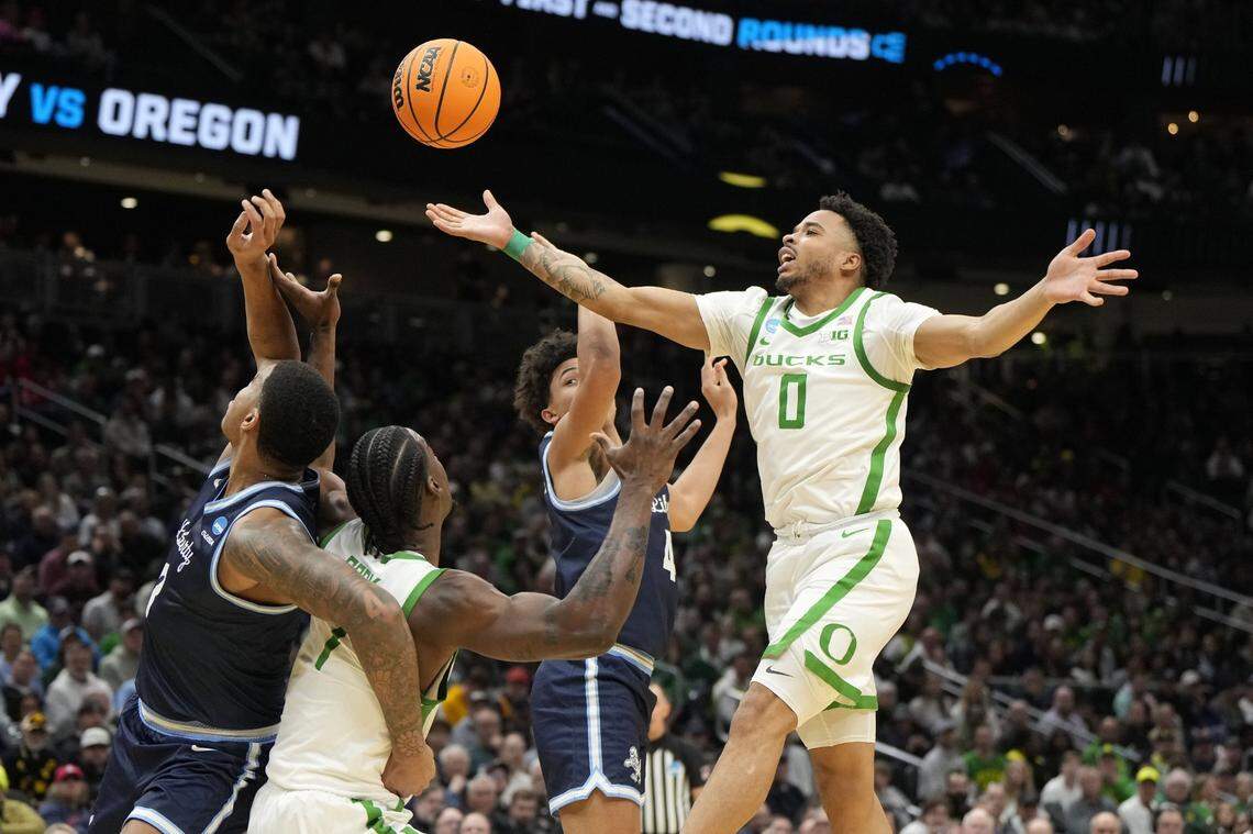Mar 21, 2025; Seattle, WA, USA; Oregon Ducks guard Ra'Heim Moss (0) attempts to get a rebound against the Liberty Flames during the first half in the first round of the NCAA Tournament  at Climate Pledge Arena. Mandatory Credit: Stephen Brashear-Imagn Images