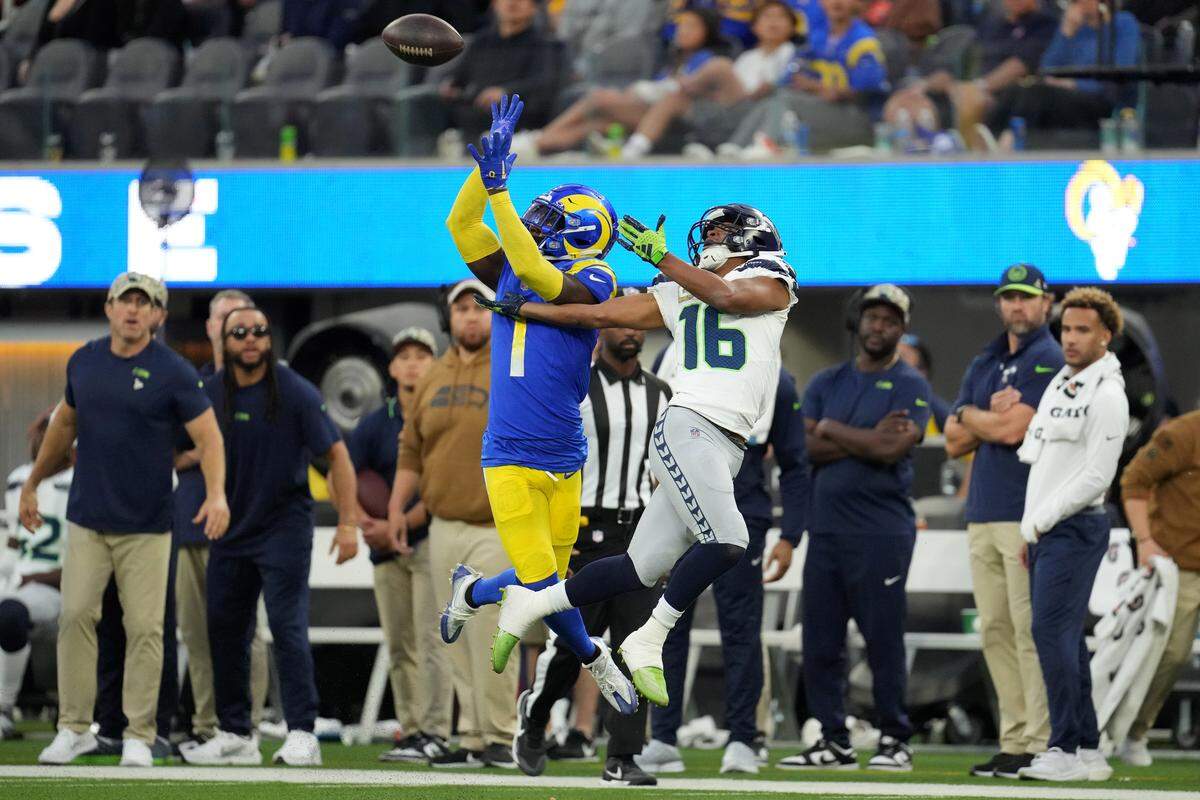 Nov 19, 2023; Inglewood, California, USA; Los Angeles Rams cornerback Derion Kendrick (1) makes a catch against Seattle Seahawks wide receiver Tyler Lockett (16) in the fourth quarter at SoFi Stadium. Mandatory Credit: Kirby Lee-USA TODAY Sports