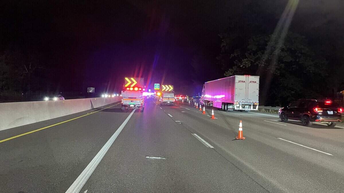 A woman who was walking in one of the southbound I-5 lanes near Joint Base Lewis-McChord was struck by a vehicle and died.