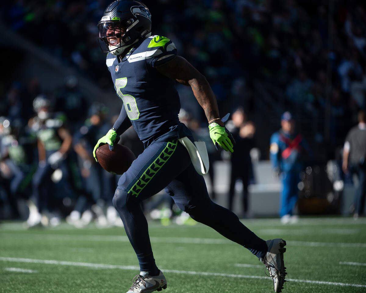 Seattle Seahawks free safety Quandre Diggs (6) celebrates after intercepting a pass thrown by Jacksonville Jaguars quarterback Trevor Lawrence (16) during the second quarter of an NFL game on Sunday at Lumen Field in Seattle.