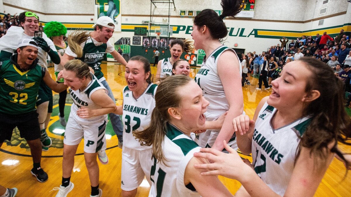 Peninsula players celebrate after the buzzer sounds at the end of the game. The Seahawks beat Gig Harbor 51-49. Peninsula played Gig Harbor in a basketball game at Peninsula High School in Purdy, Wash., on Thursday, Jan. 31, 2019.