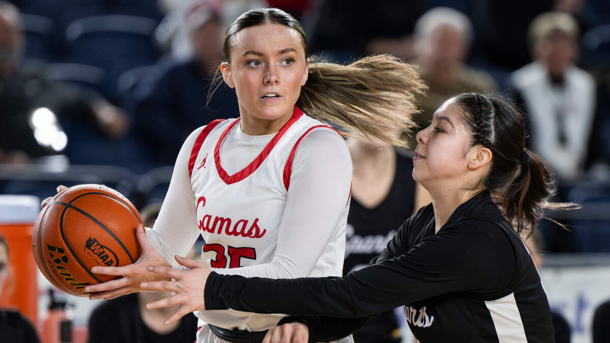 Camas’ Keirra Thompson (35) is fouled by Camas’ Kendall Mairs (2) during the semifinals game of the Class 4A state tournament at the Tacoma Dome, on Friday, March 1, 2024, in Tacoma, Wash.
