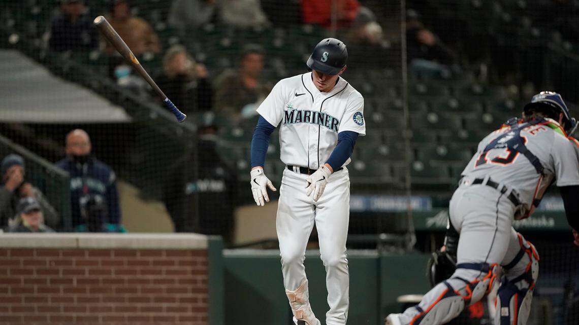 Seattle Mariners’ Jarred Kelenic tosses his bat after being hit by a pitch during the eighth inning of the team’s baseball game against the Detroit Tigers, Wednesday, May 19, 2021, in Seattle. Getting hit by a pitch can lead to an elbow fracture.