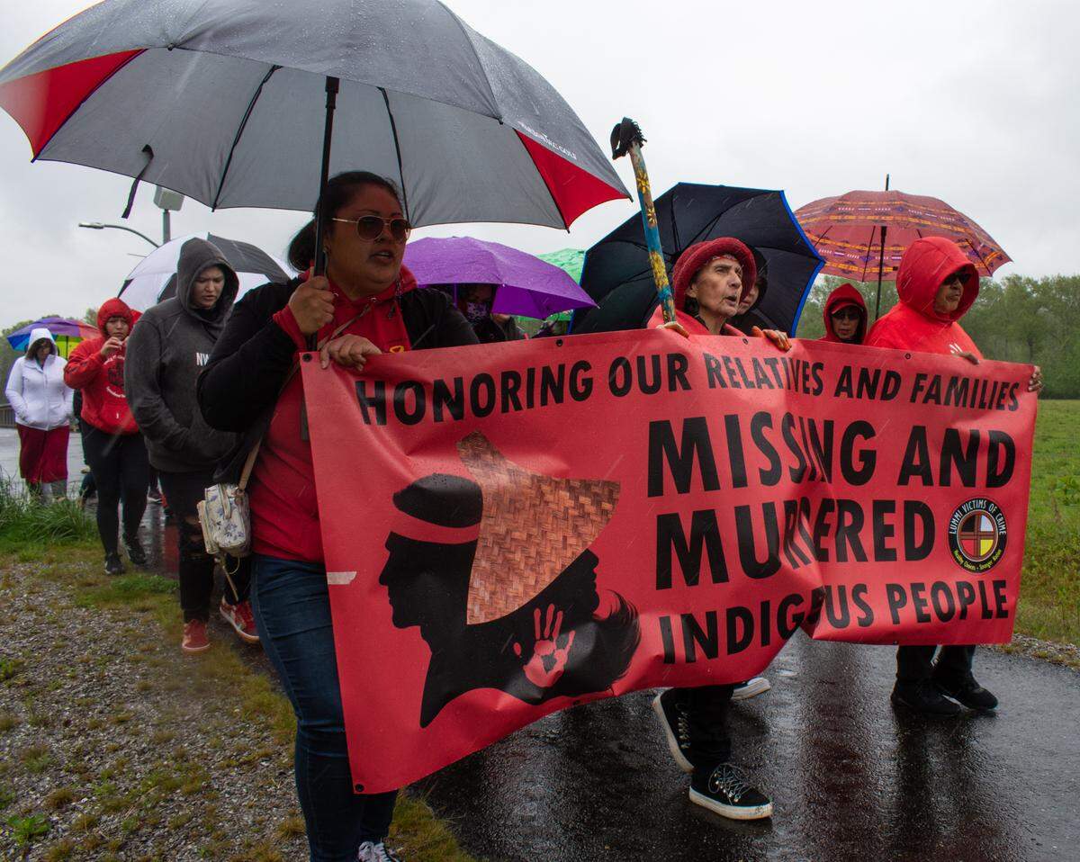 Lummi Tribal members and community members gather to march down Haxton Way in honor of Missing and Murdered Indigenous Women and People Awareness Day Thursday, May 5, on the Lummi Nation Reservation near Bellingham. The memorial walk, organized by the Tribe’s advocacy and support services group Lummi Victims of Crime, highlighted the high rate of disappearances and murders Indigenous people face.