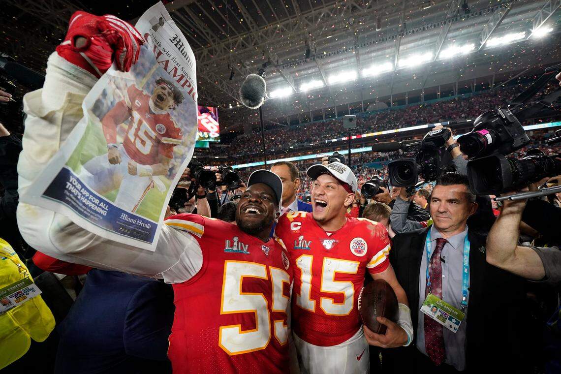 Former Seahawks defensive end Frank Clark, left, celebrating their Kansas City Chiefs’ Super Bowl win in Miami in February 2020.