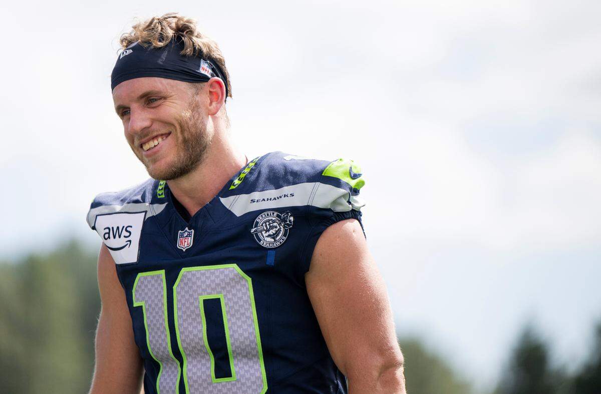 Seattle Seahawks wide receiver Cooper Kupp (10) walk off after training camp at Virginia Mason Athletic Center on Friday, July 25, 2025, in Renton.