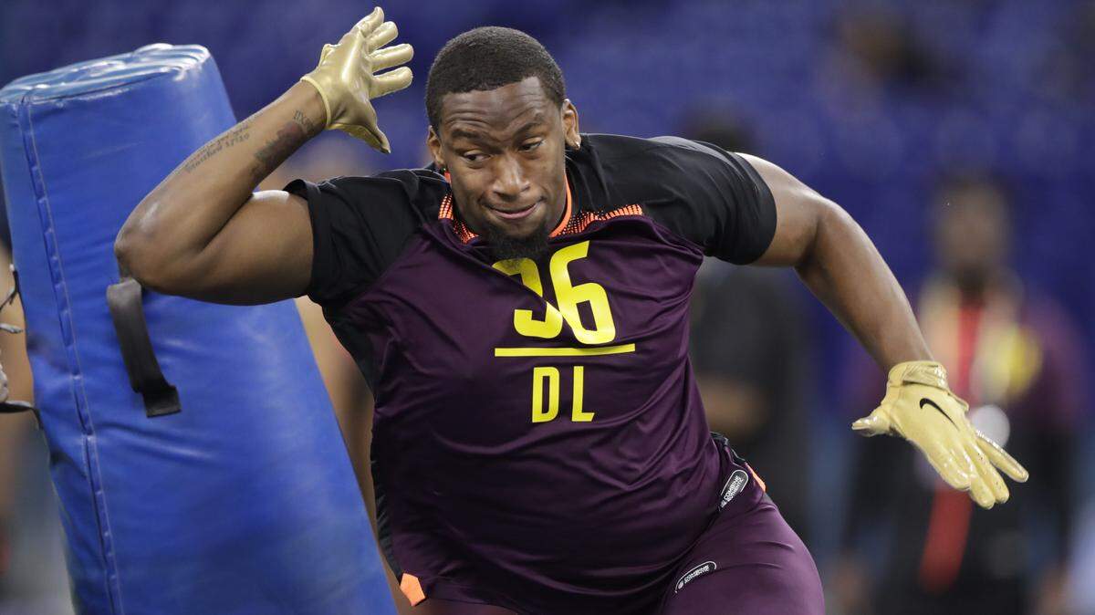 Clemson defensive lineman Clelin Ferrell runs a drill at the NFL football scouting combine in Indianapolis, Sunday, March 3, 2019. (AP Photo/Michael Conroy)