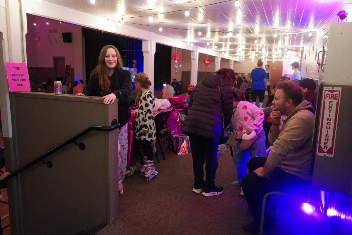 Kids and families regroup at the side of the gym during Skate Night at the Key Peninsula Civic Center in Vaughn, Wash., Friday, Feb. 13, 2026.