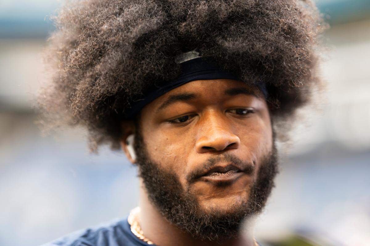 Seattle Seahawks linebacker Ernest Jones IV (13) talks with fans before the game against the Buffalo Bills at Lumen Field, on Sunday, Oct. 27, 2024 in Seattle, Wash.