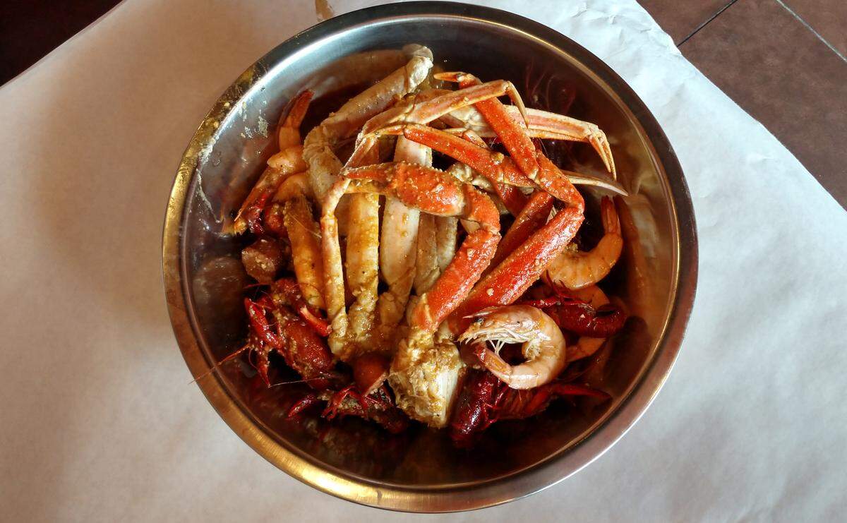 A bowl of snow crab, shrimp and crawfish boiled with spices at Boiling Crawfish, a seafood restaurant in South Hill.