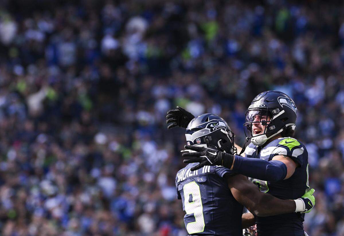 Seattle Seahawks running back Kenneth Walker III (9) and tight end AJ Barner (88) celebrate a touchdown during the second quarter of the game against the New Orleans Saints at Lumen Field, on Sunday, Sept. 21, 2025 in Seattle.