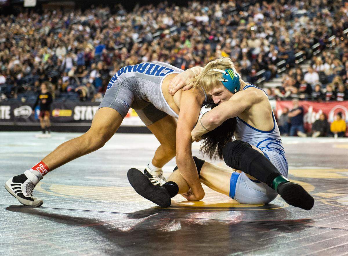 Curtis’ Ryan Wheeler wrestles Darion Johnson in the 4A 152 pound championship during day two of Mat Classic XXXII at the Tacoma Dome in Tacoma, Wash., on Saturday, Feb. 22, 2020.