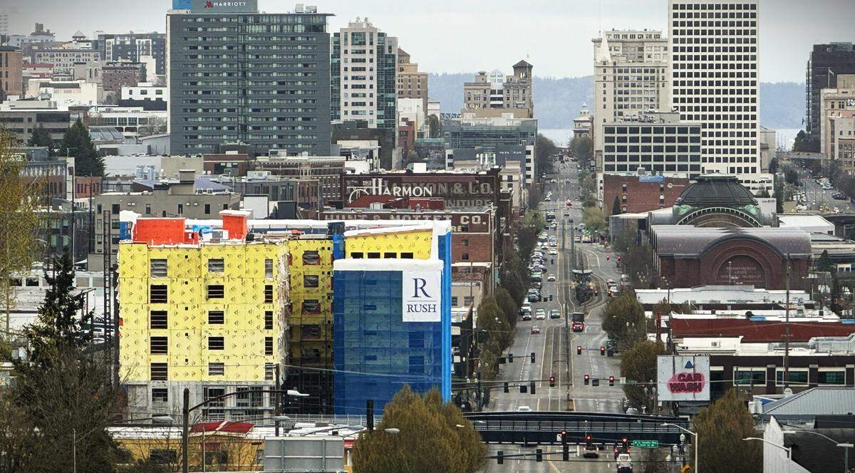 Cornus House apartment construction can be seen at left amid Tacoma’s cityscape looking down Pacific Avenue on Monday, March 25, 2024.