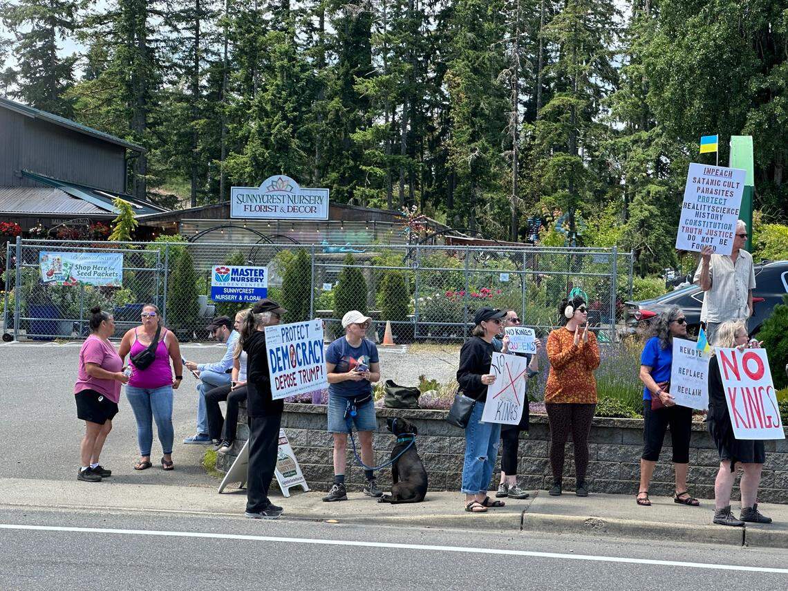 People gather for a No Kings protest in Key Center on Saturday, June 14, 2025