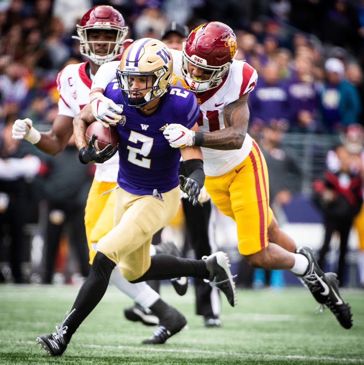 Washington Huskies wide receiver Aaron Fuller (2) is tackled after a catch in the second quarter. The Washington Huskies played the USC Trojans in a NCAA football game at Husky Stadium in Seattle, Wash., on Saturday, Sept. 28, 2019.