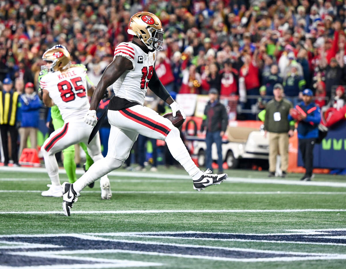San Francisco 49ers wide receiver Deebo Samuel (19) runs in a touchdown during the first quarter of the game against the Seattle Seahawks at Lumen Field, Thursday, Nov. 23, 2023, in Seattle, Wash.