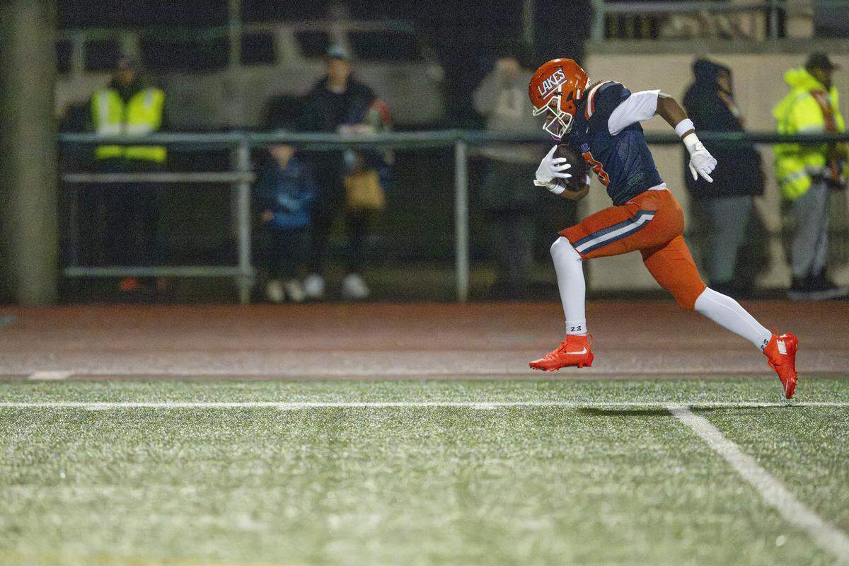 Lakes wide receiver Lee Snyder (8) sprints to the end zone for a touchdown against Capital on Friday, Oct. 24, 2025, in Lakewood, Wash.