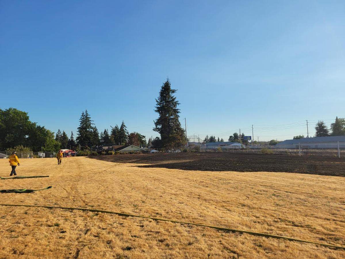 West Pierce Fire & Rescue crews kept a brush fire from spreading to two houses Sunday in a residential neighborhood in Lakewood near the 10200 block of Earley Avenue Southwest. The fire grew to about a quarter-mile long.