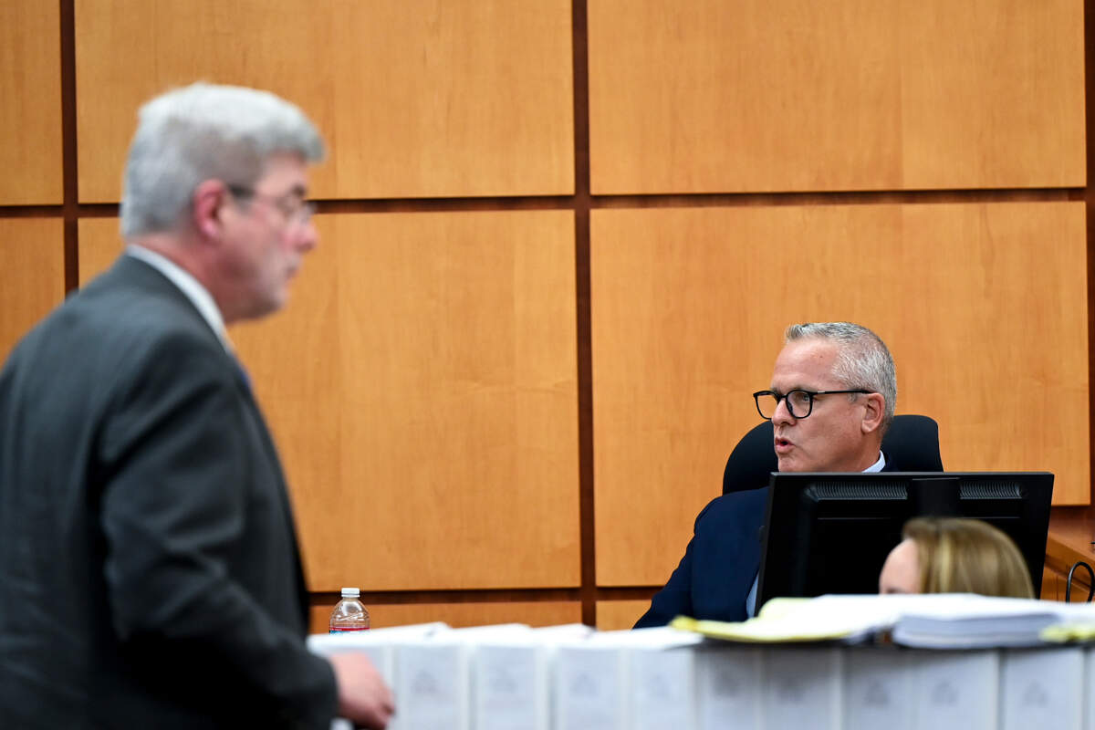 Defense attorney Wayne Fricke cross examines John J. Ryan, a police use-of-force expert, during the trial of three Tacoma Police officers in the killing of Manny Ellis at Pierce County Superior Court, Monday, Nov. 6, 2023, in Tacoma, Wash.Tacoma Police Officers Christopher Burbank, Matthew Collins and Timothy Rankine stand trial for charges related to the March 2020 killing of Manny Ellis. (Brian Hayes / Pool Photo – The News Tribune)