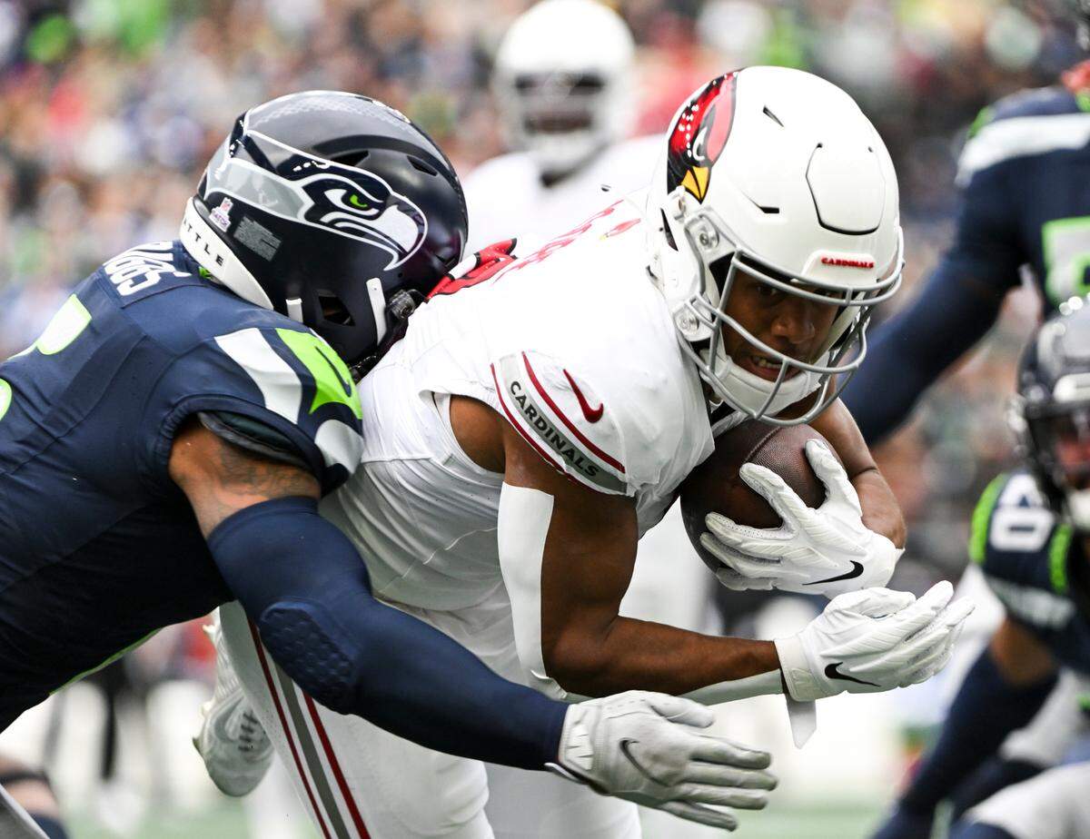 Seattle Seahawks safety Quandre Diggs (6) tackles Arizona Cardinals wide receiver Rondale Moore (4) during the second quarter of the game at Lumen Field, Sunday, Oct. 22, 2023, in Seattle, Wash.