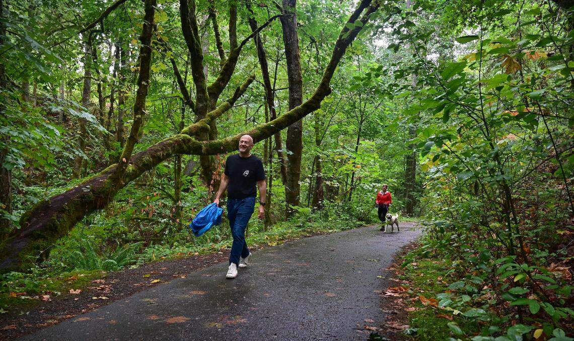 Walkers make their way up the Sequalitchew Creek Trail in DuPont, Washington, on Thursday, Aug. 15, 2024. 