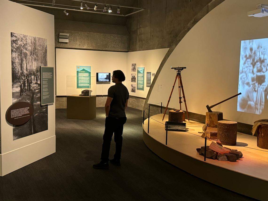 A visitor walks through “Natural Remedy — The Civilian Conservation Corps in Washington & Oregon” at the Washington State History Museum in Tacoma.
