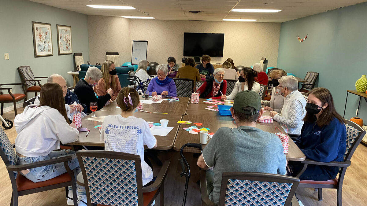 A gathering of LHA volunteers and seniors enjoying each others company.