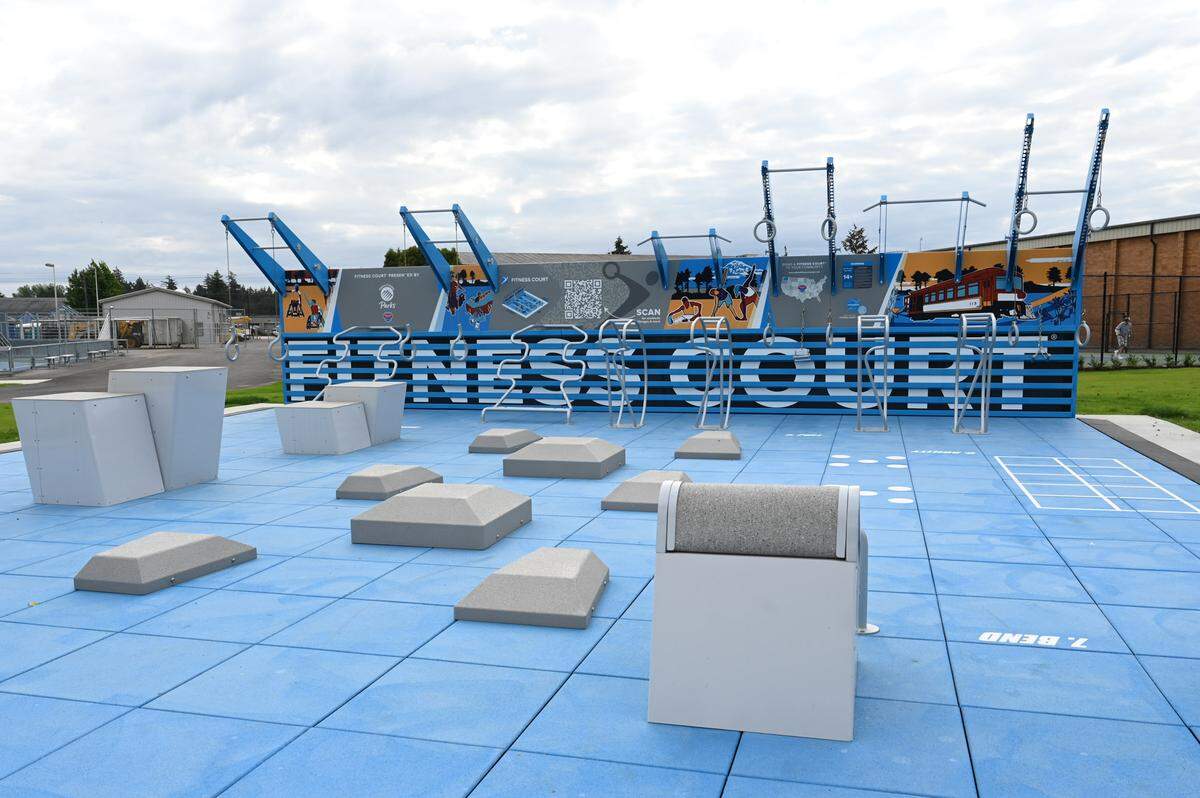 A newly built outdoor fitness court is one of the new amenities at Sprinker Recreation Center on Friday, Aug. 16, 2024 in Spanaway. Other new amenities include a new splash pad, playground and new play fields.