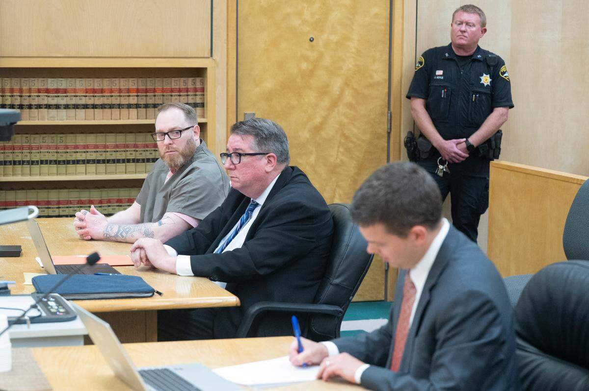 Kurtis William Monschke, left, sits through a resentencing hearing on Friday, June 27, 2025, at Pierce County Superior Court in Tacoma. Monschke was convicted of aggravated first-degree murder in 2003. His sentence of life without parole was declared unconstitutional in 2021 by the state Supreme Court.