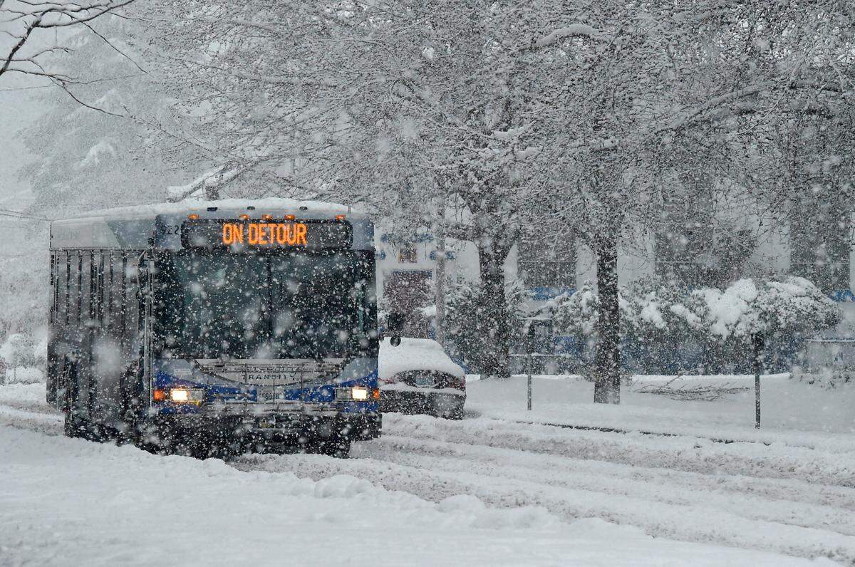 An Intercity Transit bus makes its way through snowy roads during February’s back-to-back snowstorms.