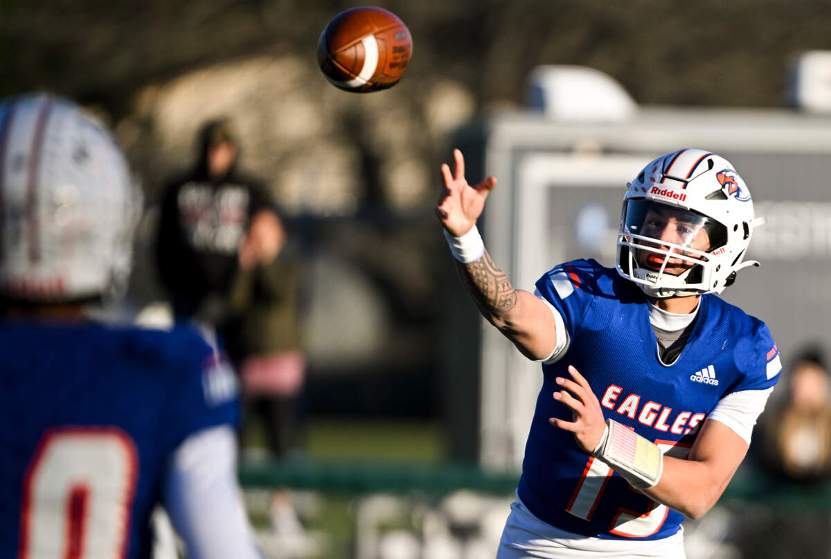 Graham-Kapowsin’s Daveon Superales (15) connects with Graham-Kapowsin’s Jabez Woods (10) for a quick conversion during the second half of the 4A semifinal state game against the Eastlake Wolves at Art Crate Field, Saturday, Nov. 25, 2023, in Spanaway, Wash.