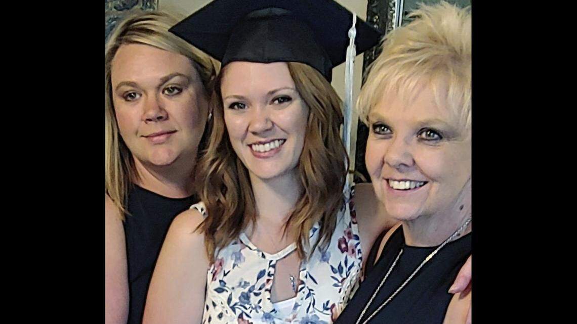 Brianna Hayes, center, poses with her older sister Darci Hayes, left, and mother, Sharon Hayes, right, in June 2019 after graduating from her graduate school program at Eastern Washington University in Cheney. Sharon Hayes sued her former fertility doctor on Oct. 25, 2023, saying he secretly used his own sperm to inseminate her when she became pregnant with her second daughter 34 years ago.