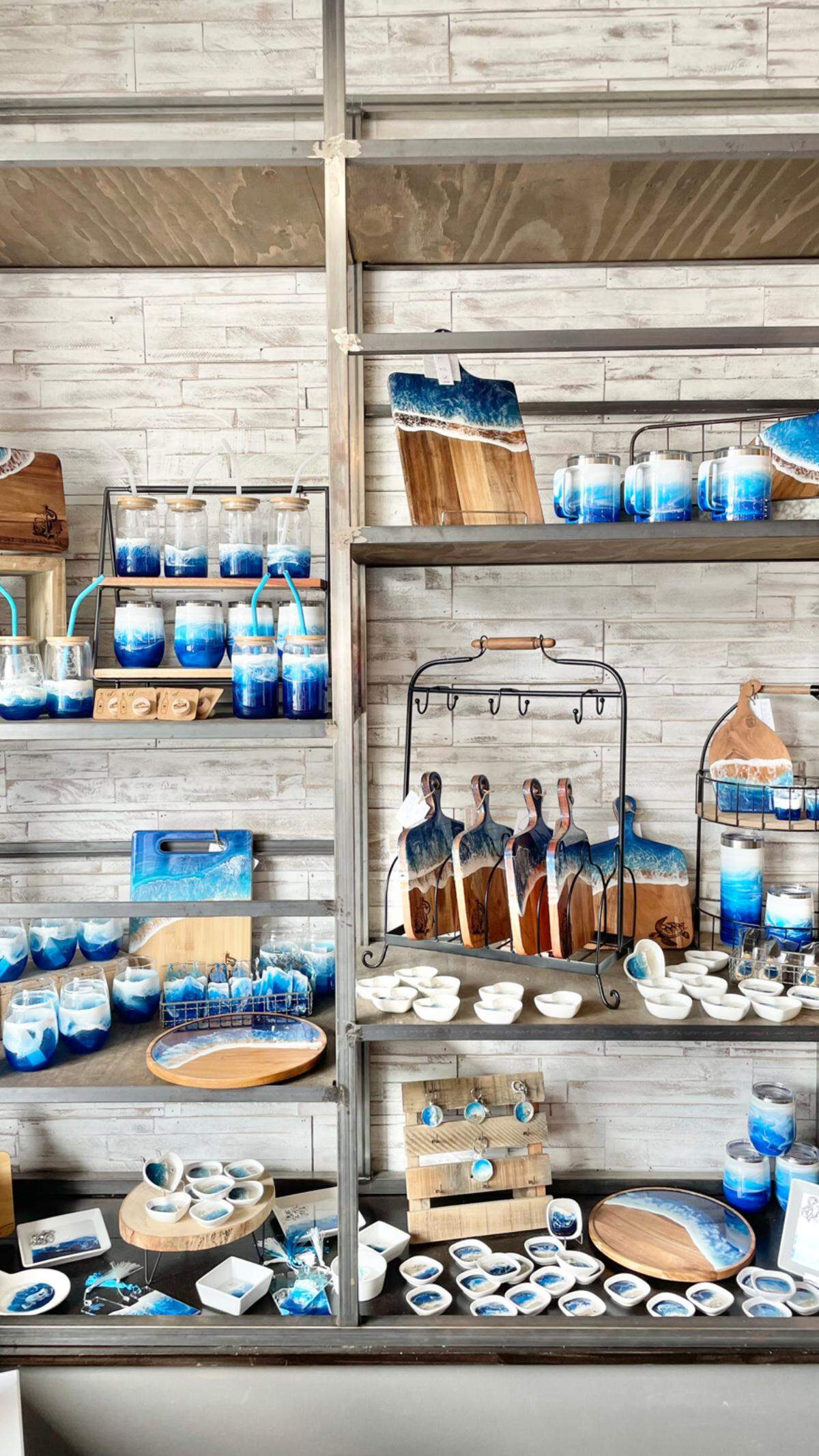 Co-owner of Local Whimsy, Caasi Dickens, is also a local maker. She pours ocean resin over cutting boards, glasses and other items. 