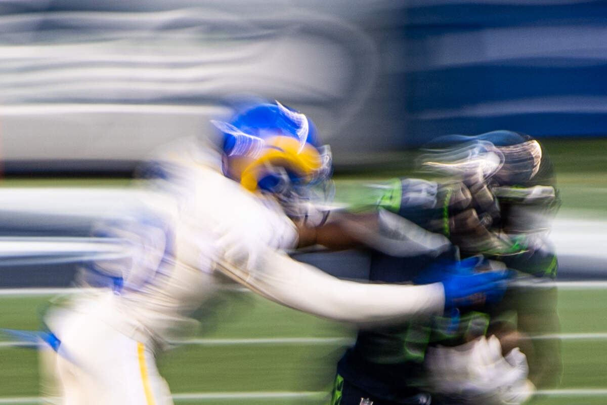 Seattle Seahawks wide receiver DK Metcalf tries to break a tackle by Los Angeles Rams cornerback Jalen Ramsey during the fourth quarter. The Seattle Seahawks played the Los Angeles Rams in a NFL football game at Lumen Field in Seattle, Wash., on Sunday, Dec. 27, 2020.