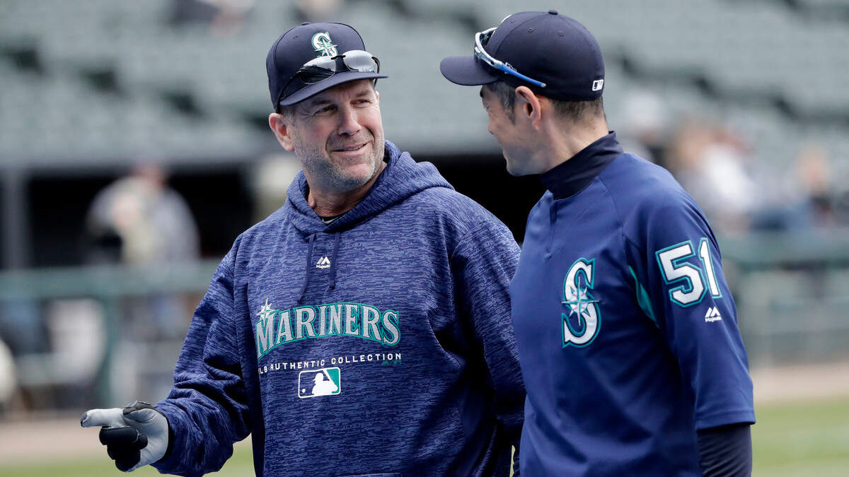 Seattle Mariners’ Ichiro Suzuki, right, listens to hitting coach Edgar Martinez during batting practice before a baseball game against the Chicago White Sox Monday, April 23, 2018, in Chicago. (AP Photo/Charles Rex Arbogast)