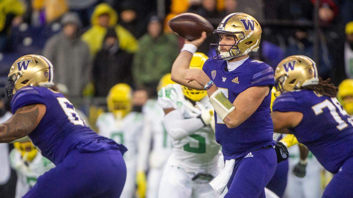 Washington quarterback Dylan Morris (9) attempts a pass in the second quarter of a Pac-12 game against Oregon on Saturday at Husky Stadium in Seattle.