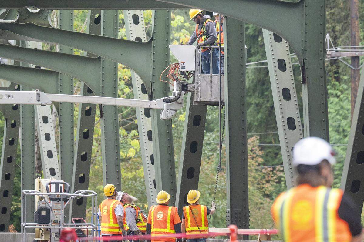 Work takes place on the White River Bridge on Monday, Sept. 8, 2025, in Enumclaw.