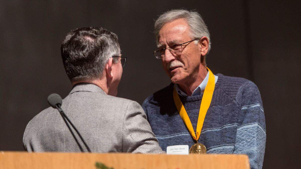 Jim Van Beek with President Krise at the PLU faculty and staff lunch, Thursday, Dec. 15, 2016. (Photo: John Froschauer/PLU)