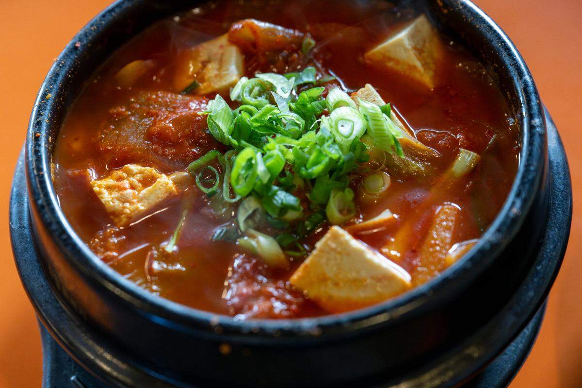 Steam rises off the kimchi stew at Mukja Korean BBQ on Friday, April 18, 2025, in Puyallup, Wash. The stew is based on a family recipe from restaurant owner Lisa Yi.