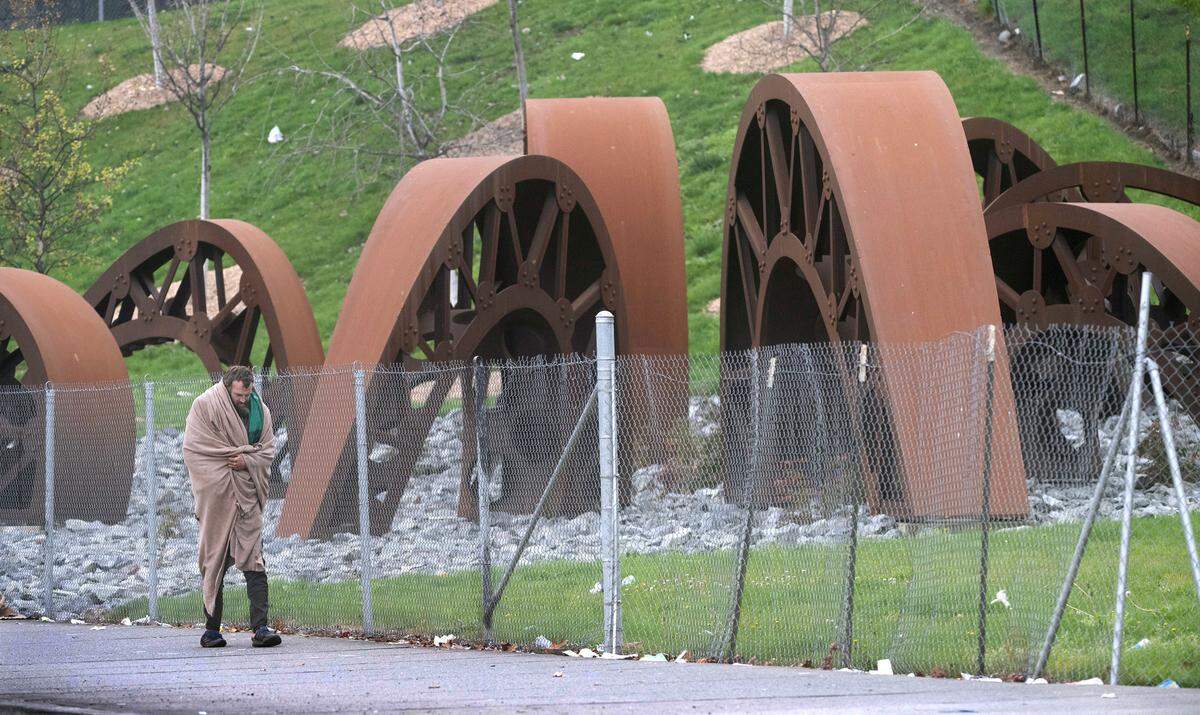 The “Gertie’s Ghost” sculpture park next to Sound Transit’s railroad line in downtown Tacoma, Washington, has been fenced in since its installation in 2019. The city says it’s to protect the young trees planted there, shown on Wednesday, Dec. 4, 2024, as well as protect the sculpture from vandalism.