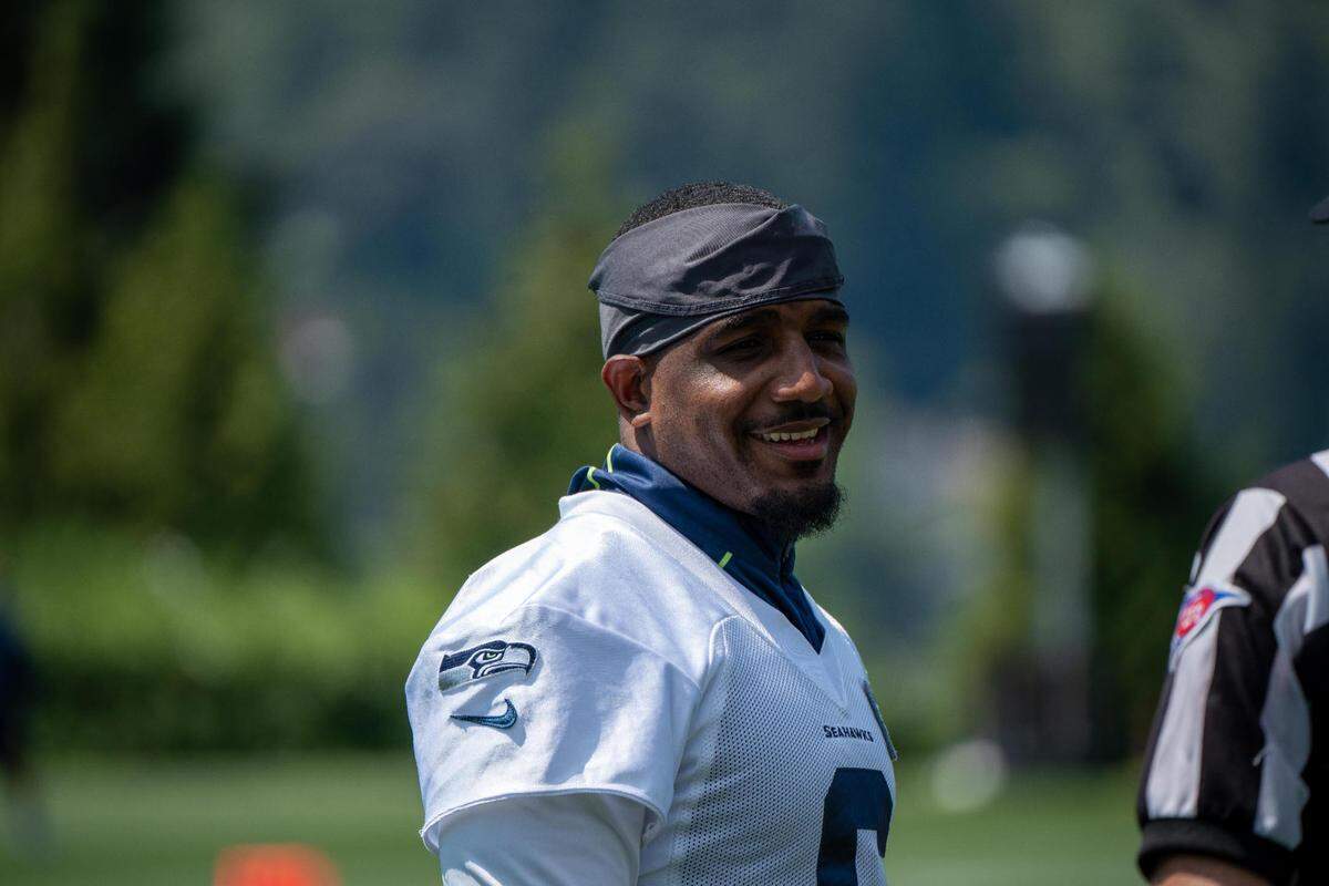 Seattle Seahawks free safety Quandre Diggs talks wirth the referee during the first day of training camp at the Virginia Mason Athletic Center on July 27, 2022.