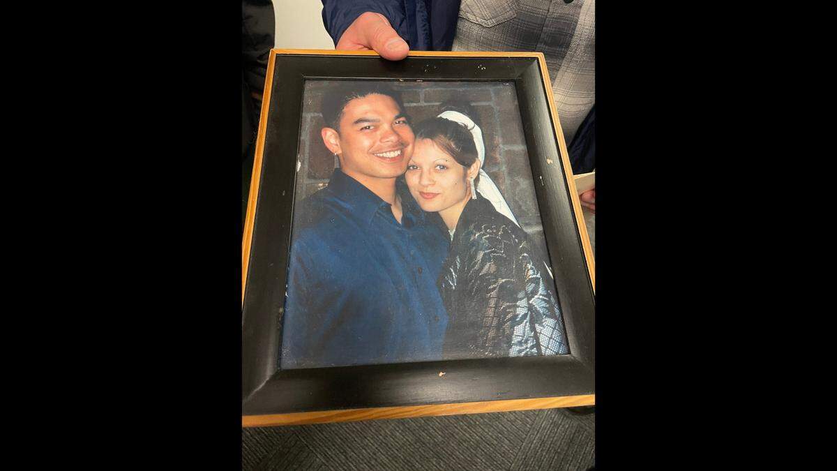 Ernesto LaGuardia, 51, holds a photograph of him and his wife, Stephanie, taken on the day they were married, June 16, 2001, shown here in Pierce County Superior Court in Tacoma, Washington, on Feb. 7, 2025.