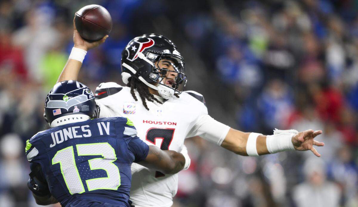 Seattle Seahawks linebacker Ernest Jones IV (13) sacks Houston Texans quarterback C.J. Stroud (7) forcing the fumble during the second quarter of the game at Lumen Field, on Monday, Oct. 20, 2025, in Seattle. The resulting play and safety was called back.