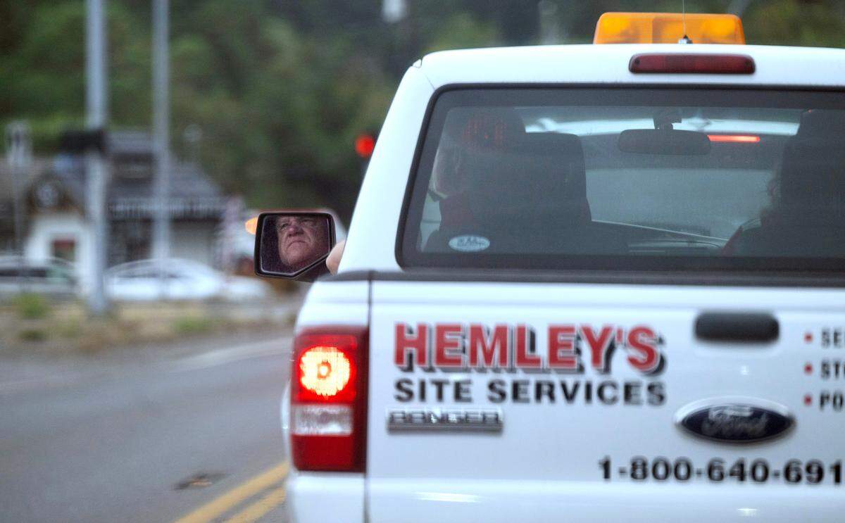 Hemley’s Septic Service owner Jerry Hemley drives to the Key Peninsula to perform a septic tank inspection and cleaning on Aug. 13.