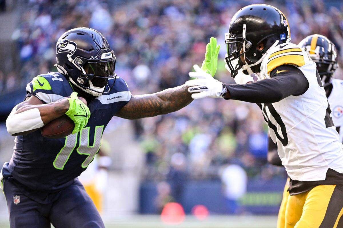 Seattle Seahawks wide receiver DK Metcalf (14) stiff arms Pittsburgh Steelers cornerback Patrick Peterson (20) after a 21-yard catch during the second quarter of the game at Lumen Field, on Sunday, Dec. 31, 2023, in Seattle, Wash.