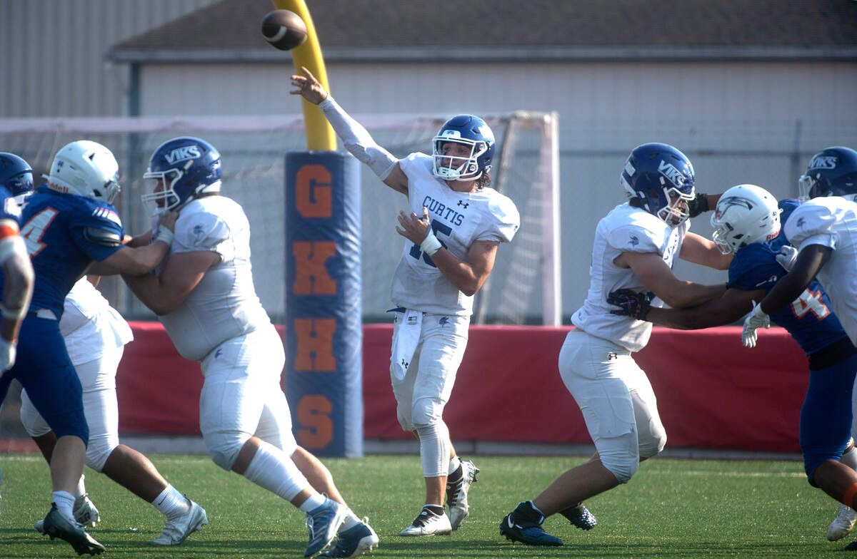 Curtis quarterback Rocco Koch fires a pass during Saturday’s football game against the Graham-Kapowsin Eagles at Art Crate Field in Spanaway, Washington, Oct. 8, 2022. Graham-Kapowsin won the game, 24-19.